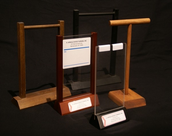 Custom wood display cases with transparent panels designed for showcasing retail products.